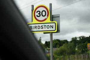 traffic sign displaying area of Birdston, is approaching